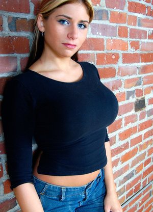 1 dark haired female tortures another during lezdom play in concrete cellar